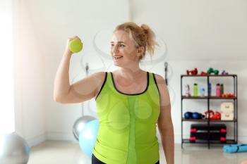 Body positive woman training in gym�