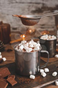 Cup of hot chocolate with marshmallows on table�