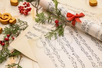 Christmas composition with music notes on table�