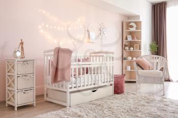 Interior of stylish children's room with baby bed�
