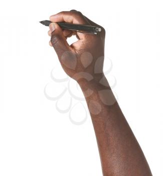 Hand of African-American man with pen on white background�