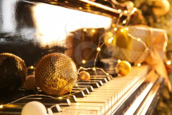 Piano keyboard with Christmas decor, closeup�