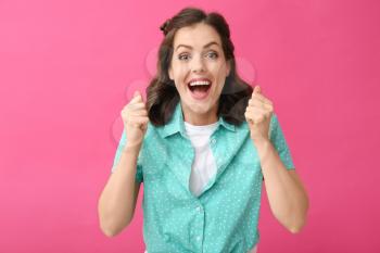 Surprised young woman on color background�