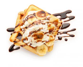 Tasty waffles with banana, chocolate and ice-cream on white background�