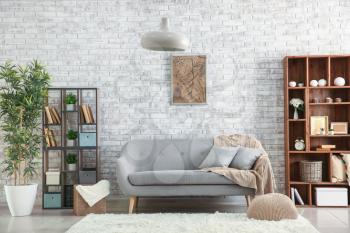 Interior of modern room with brick wall�