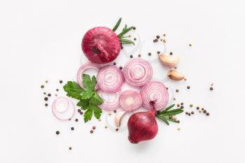 Fresh raw onions with spices on white background�