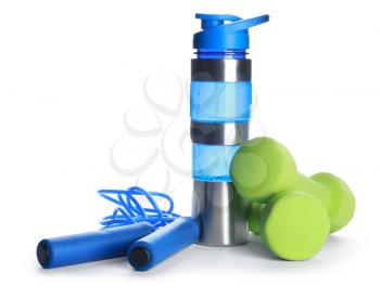 Sports water bottle, dumbbells and jumping rope on color white�