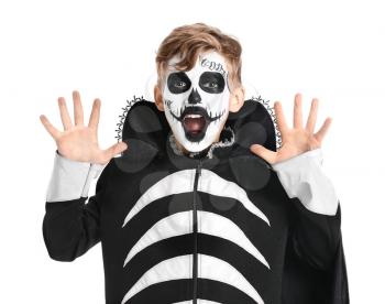 Little boy in Halloween costume on white background�