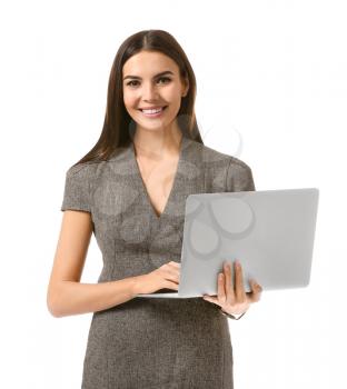 Beautiful young businesswoman with laptop on white background�