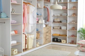 Wardrobe with stacks of clean clothes�