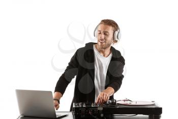 Male dj playing music on white background�