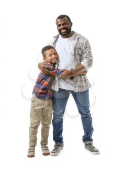 Portrait of African-American man with his little son on white background�