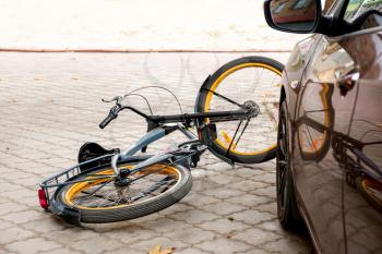 Accident between car and bicycle on city street�