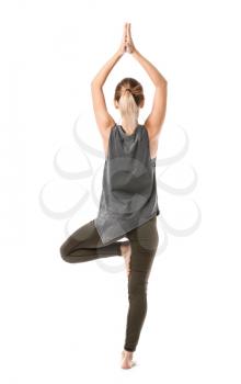 Beautiful young woman practicing yoga on white background�