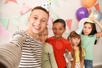 Happy children taking selfie at Birthday party�