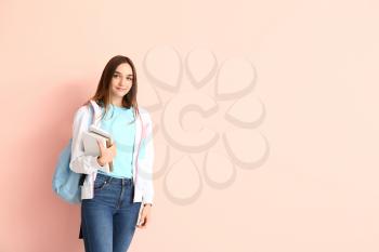 Portrait of teenage schoolgirl on color background�