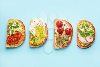 Tasty sandwiches on color background�