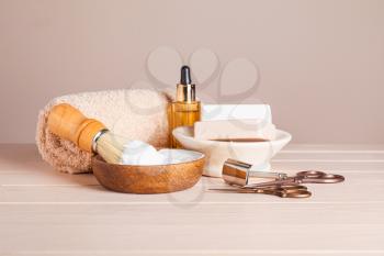 Set for male shaving on white wooden table�