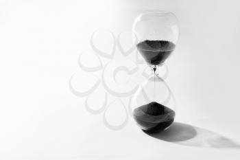Crystal hourglass on light background�