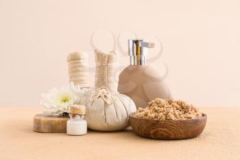 Cosmetics with herbal bags on light background�