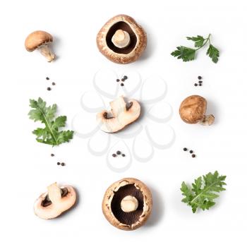 Fresh champignon mushrooms, herbs and spices on white background�