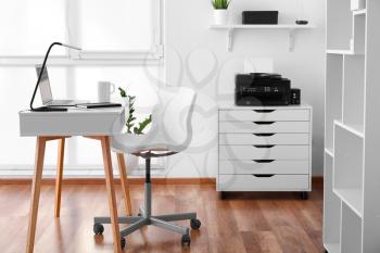 Modern stylish workplace with laptop in office�