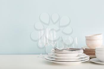 Set of clean dishware on table�