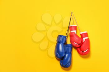 Boxing gloves on color background�
