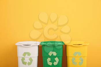 Containers for garbage near color wall. Recycling concept�