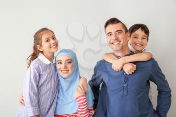 Portrait of Muslim family on light background�
