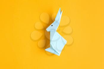 Origami rabbit on color background�
