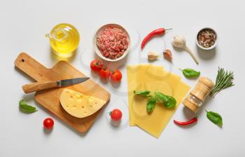 Ingredients for lasagna on white background�