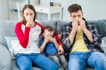 Family suffering from allergy at home�