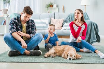 Family suffering from pet allergy at home�