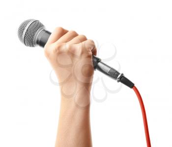 Female hand with microphone on white background�