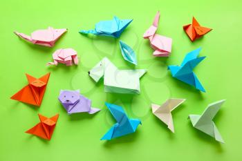 Many origami figures on color background�