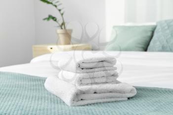 Clean soft towels on bed�