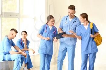 Group of medical students in hall of clinic�