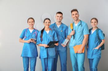 Group of medical students on light background�