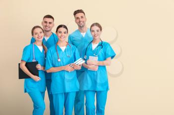 Group of medical students on light background�