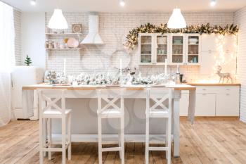 Interior of kitchen decorated for Christmas celebration�