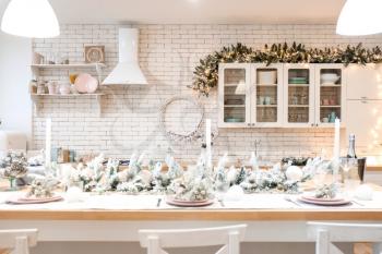 Beautiful table setting for Christmas celebration in kitchen�
