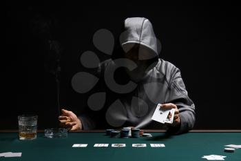 Male cardsharper playing in casino�