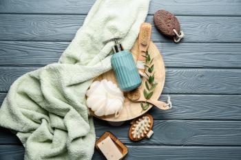 Set of bath accessories on wooden background�