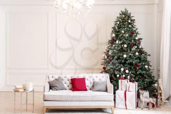 Interior of room with beautiful decorated Christmas tree�