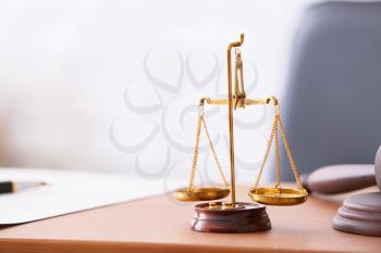 Scales of justice on lawyer's workplace�