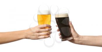 Hands clinking glasses of beer on white background�