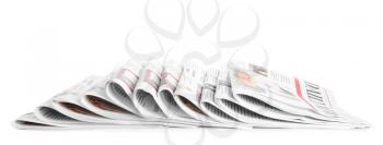 Many newspapers on table against white background�