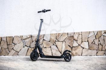 Modern electric kick scooter outdoors�