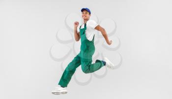 Jumping African-American teenager boy in uniform on white background�